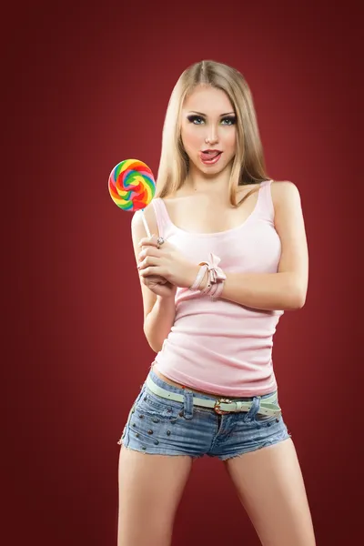 Glamourous girl holding lollipop — Stock Photo, Image