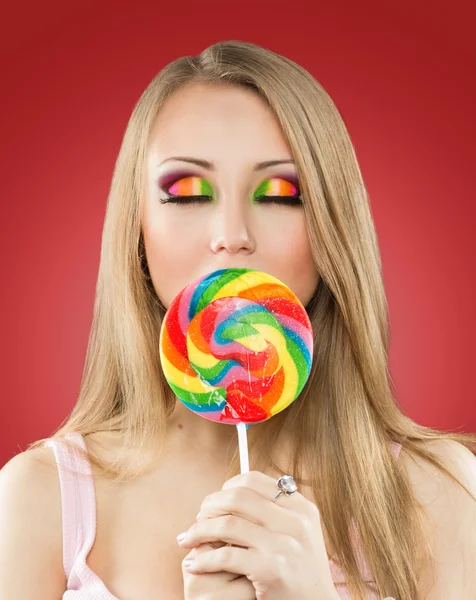 Glamourous girl holding lollipop — Stock Photo, Image
