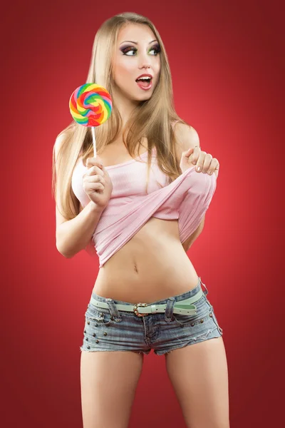 Glamourous girl holding lollipop — Stock Photo, Image