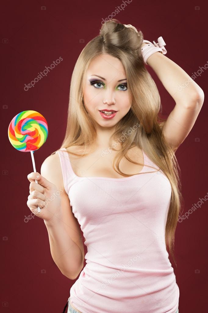 Glamourous girl holding lollipop — Stock Photo © kopitin 40962825