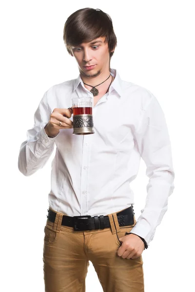 Active young man drinking tea — Stock Photo, Image