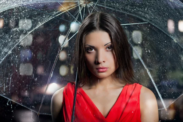 Pretty woman with umbrella under — Stock Photo, Image