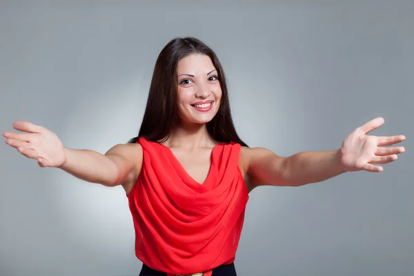 Girl in a red dress, emotion — Stock Photo, Image