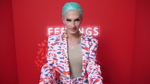 First-person view, travesty actor in a blue wig leads someone by the hand into the red room — Stock video