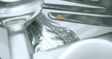 extreme close-up, detailed. stainless steel spoons and forks