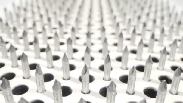 Extremely close-up detailed. nails on a white board sadhu for meditation — Wideo stockowe