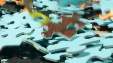 extremely close-up detailed plan. randomly falling multi-colored puzzles