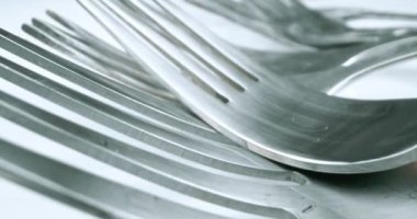 extreme close-up, detailed. stainless steel forks.