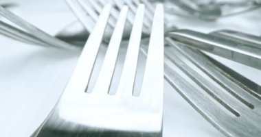 extreme close-up, detailed. stainless steel forks.