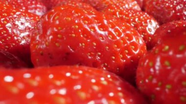 extreme close-up of a bunch of ripe strawberries, detailed
