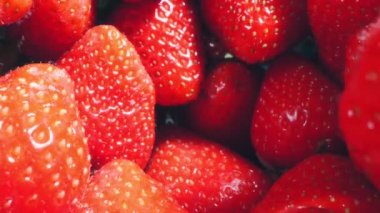 extreme close-up of a bunch of ripe strawberries, detailed.