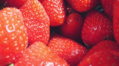 extreme close-up of a bunch of ripe strawberries, detailed.