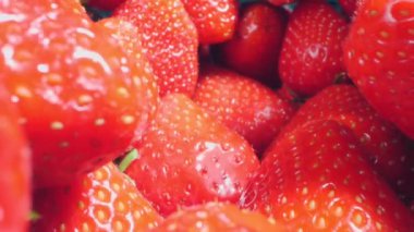 extreme close-up of a bunch of ripe strawberries, detailed.