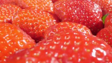 extreme close-up of a bunch of ripe strawberries, detailed.