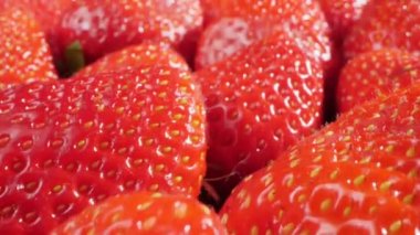 extreme close-up of a bunch of ripe strawberries, detailed.