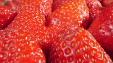 extreme close-up of a bunch of ripe strawberries, detailed.