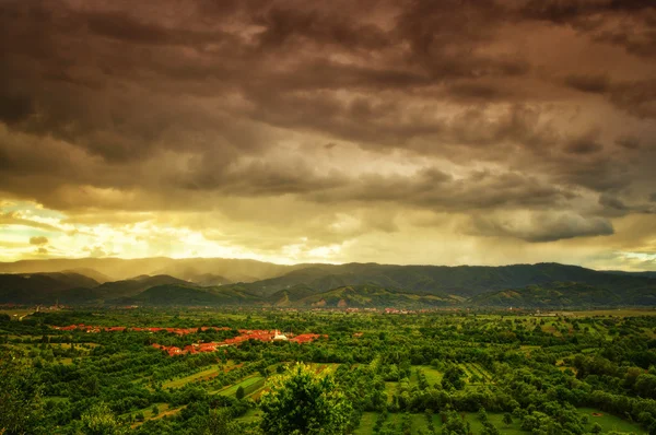 Storm scene with green hills — Stock Photo, Image
