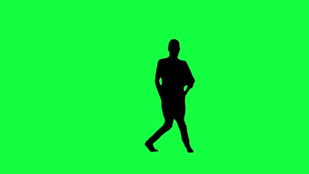 Silhuetten av en dansande kvinna mot en grön bakgrund — Stockvideo