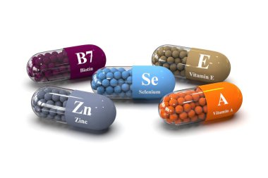 B7 vitamini, çinko, A vitamini, E vitamini ve beyaz arka planda selenyum içeren kapsüller. Tıbbi 3B canlandırma