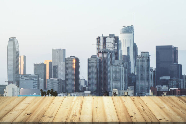 Table top made of wooden dies with beautiful Los Angeles skyline on background, mockup