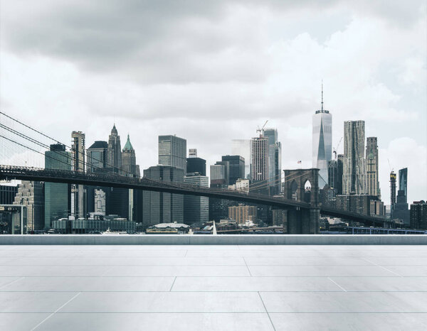 Empty concrete embankment on the background of a beautiful New York city skyline and Brooklyn bridge at daytime, mockup