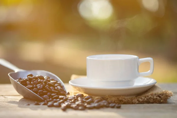 Close Cup Coffee Coffee Beans Outdoor Wooden Table Morning Sunlight — Stock Photo, Image