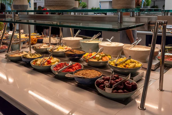 Typical Israeli breakfast buffet at any hotel. Variety of pickled foods including vegetables, beets peppers and cucumbers, with soft cheeses.