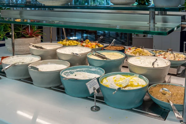 Typical Israeli breakfast buffet at any hotel. Soft cheese buffet including cottage cheese, different flavored sour cream, labane, and eshel. Traditional Israeli breakfast foods.