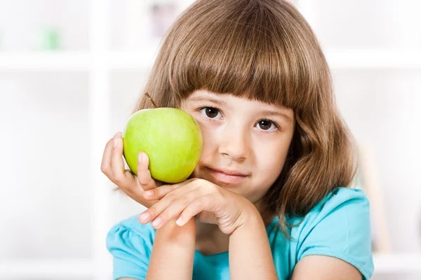 Beautiful little girl with apple Stock Photo