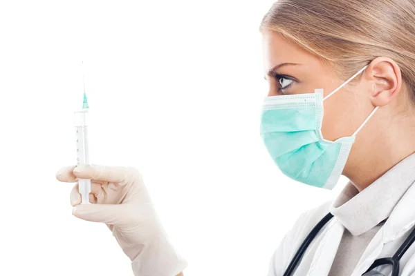 Doctor with protective mask and syringe — Stock Photo, Image