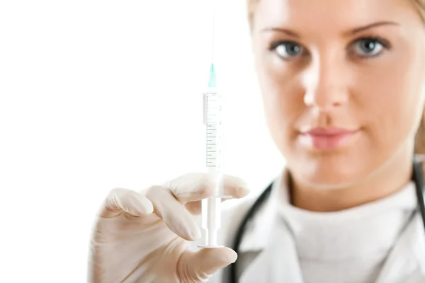 Doctor holding a syringe in her hand — Stock Photo, Image