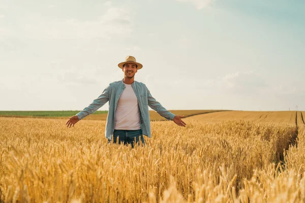 Happy Farmer Standing His Growing Wheat Field — Fotografia de Stock