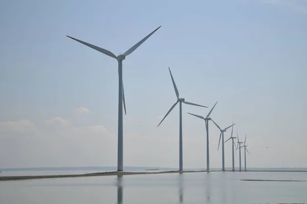 Wind farm windmills on the sea in Denmark.