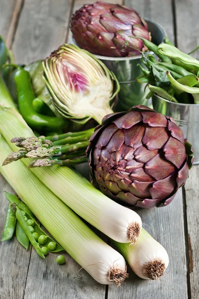 Mix of green vegetables on old wood background — Stock Photo, Image