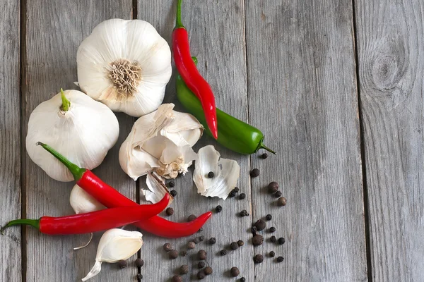 Knoflook en paprika achtergrond — Stockfoto