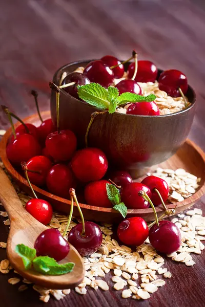 Oat flakes with cherry — Stock Photo, Image
