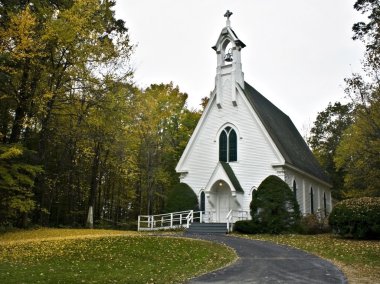 Country church in fall color clipart
