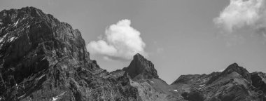rocky mountain peaks and clouds