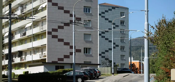 facades of residential block buildings at the edge of town
