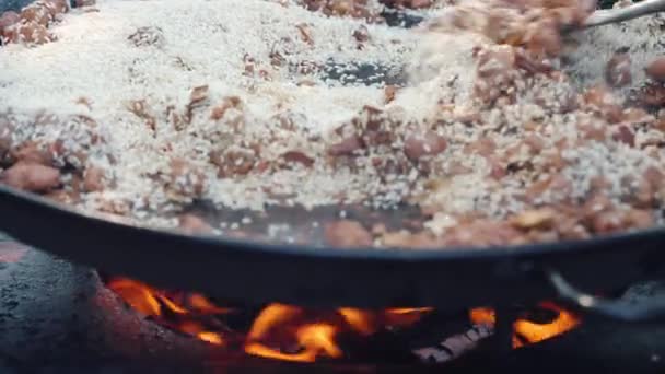 Oriental Street Food Cooking Large Metal Cauldron Sausages Chicken Frying — Video