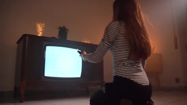 Woman Long Brown Hair Sitting Floor Dark Illuminated Room Holding — 图库视频影像