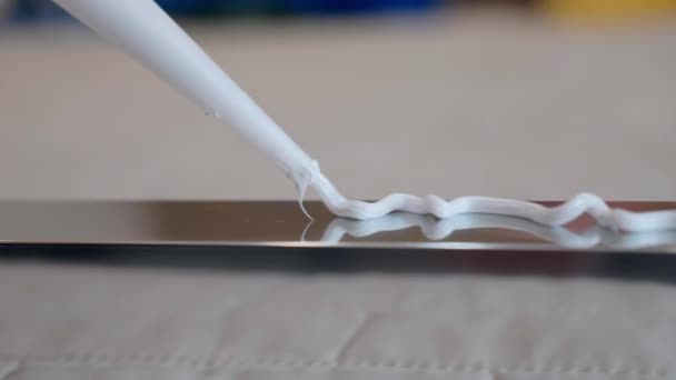 Close Shot White Glue Applying Zig Zag Metal Profile Surface — Stock videók