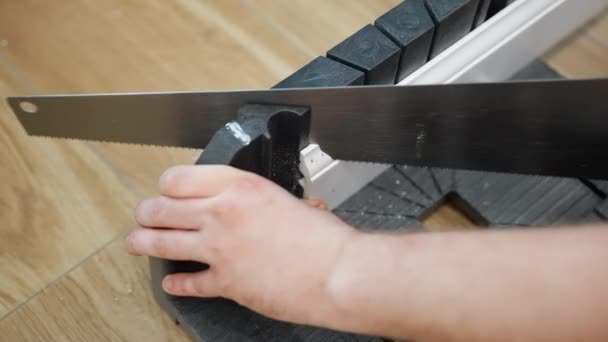 Top View Shot Skirting Board Cutting Craftsman Using Hand Saw — Vídeo de stock