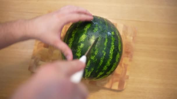 Top View Shot Person Hands Cutting Ripe Striped Watermelon Wooden — Stockvideo