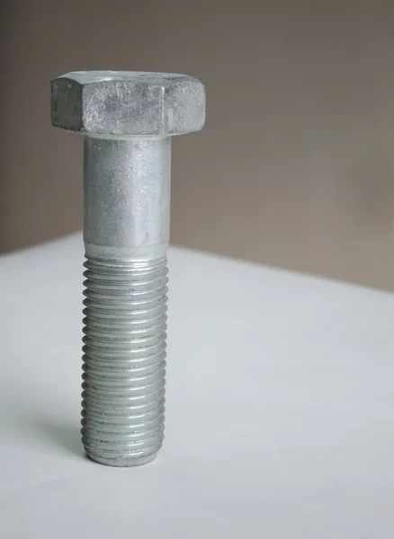 A bolt on the tablel — Stock Photo, Image