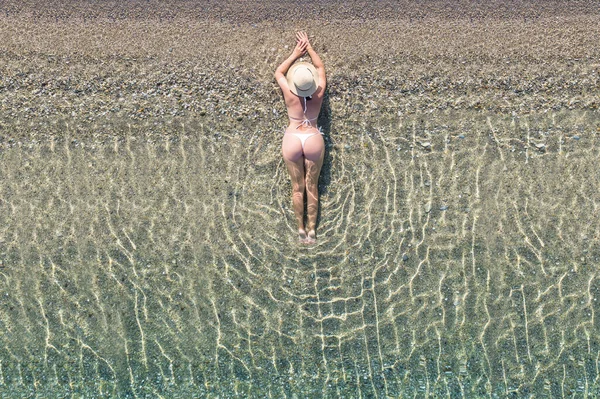 Young Athletic Woman Hat Swimsuit Lying Sea Water Sand Beach — Stock Photo, Image