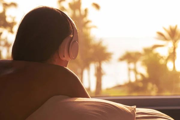 Silhouette Woman Headphones Lying Pillow Bed Bedroom Panoramic Window View — Stock Photo, Image