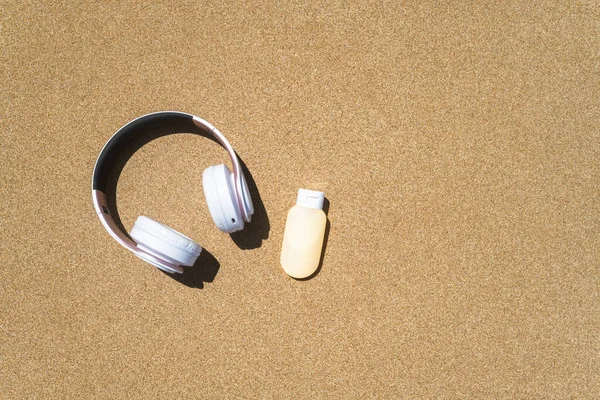Sunscreen Headphones Lying Sand Beach Travel Holiday Summertime Concept Copy — Stock Photo, Image
