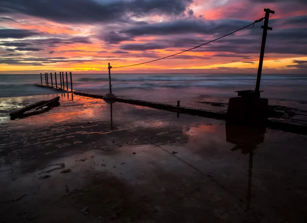 Sunset at pier long exposure LE — Stock Photo, Image