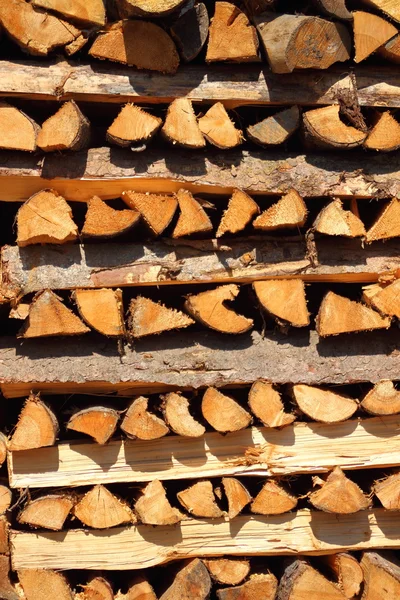 Close up on vertical placed pile of fire wood in vertical — Stock Photo, Image